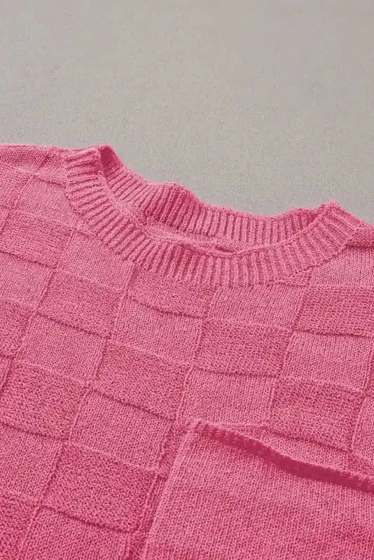 Detail shot of neckline and chest pocket on FashionFitz pink Lattice Short Sleeve Sweater, showing ribbed collar and textured fabric.