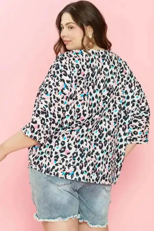 Back view of Leopard Print Batwing Half Sleeve Plus Size Top showing batwing sleeve silhouette and V-neckline — Fashionfitz