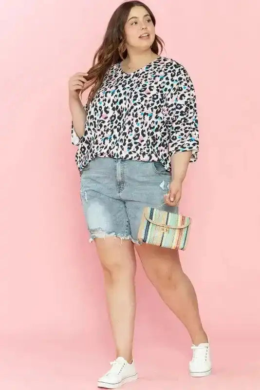 Side view of Leopard Print Batwing Half Sleeve Plus Size Top showing shift silhouette and brown leopard — Fashionfitz
