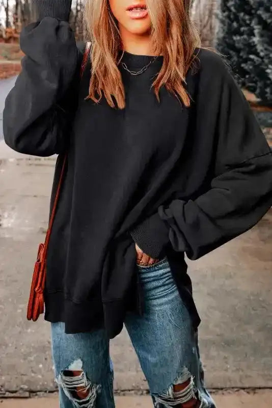 Model styling Leopard Patchwork Bishop Sleeve Sweatshirt | Unique & Trendy with casual accessories and distressed jeans.