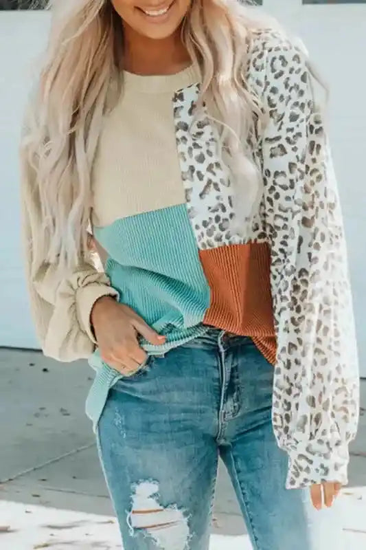 Long sleeve tops leopard patchwork color block ribbed long with crew neck and balloon sleeves, styled with distressed jeans.