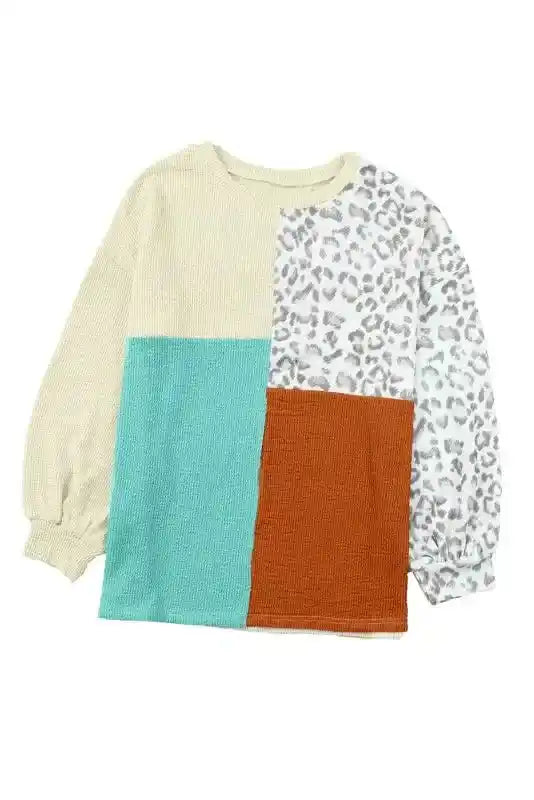 Front flat lay of long sleeve tops leopard patchwork color block ribbed long with beige, teal, rust, and leopard print panels.
