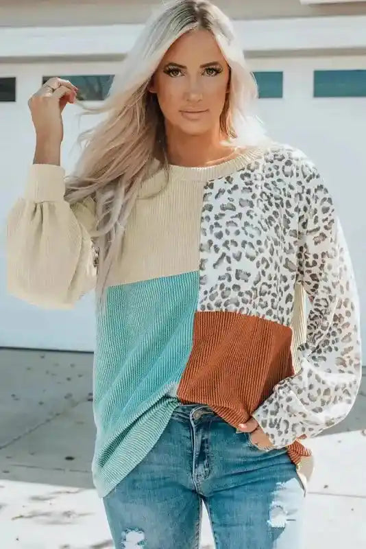 Trendy ribbed knit long sleeve top featuring leopard print and color block design in fall tones, styled for daily wear.