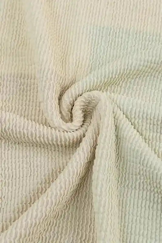 Textured beige ribbed knit fabric detail from long sleeve tops leopard patchwork color block ribbed long for fall fashion.