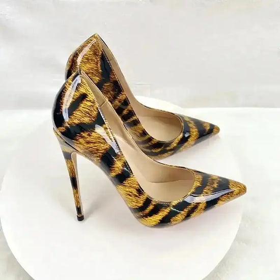 Trendy Leopard High Heels for Women Court Shoes with pointed toe and stiletto heel in glossy PU leather. Perfect for bold fashion statements.