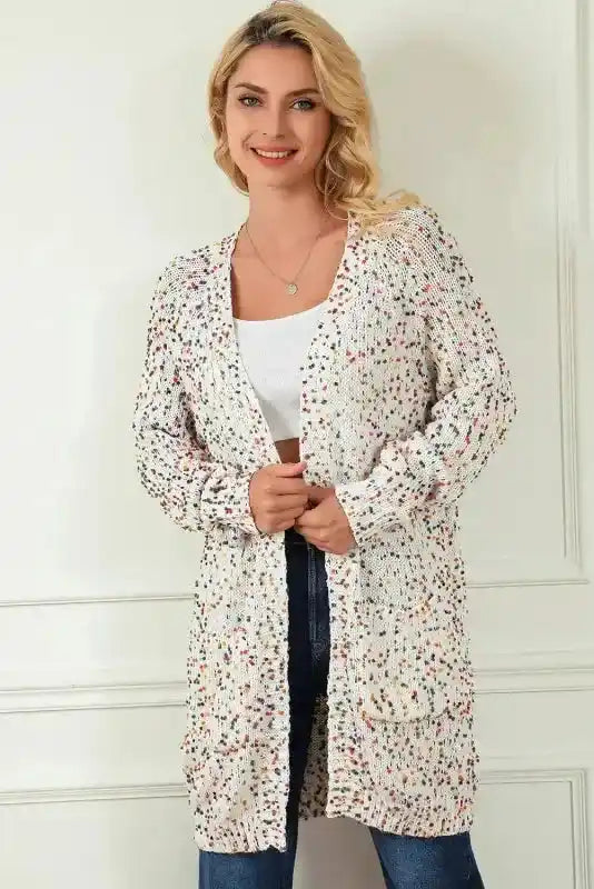 Smiling model in colorful cable knit sweater cardigan with front pockets, ideal for cozy winter outfits and daily wear.
