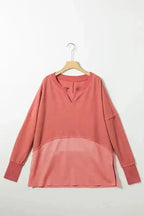 Flat lay of dusty rose Women's Exposed Seam Waffle Knit Tunic Top on hanger, highlighting its long sleeves and relaxed silhouette.