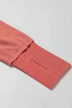 Close-up of thumbhole cuff on dusty rose Women's Exposed Seam Waffle Knit Tunic Top, emphasizing comfort and functionality.