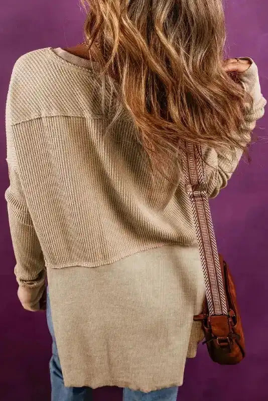 Back view of Women's Exposed Seam Waffle Knit Tunic Top in light beige, showing ribbed texture and relaxed fit for casual autumn wear.