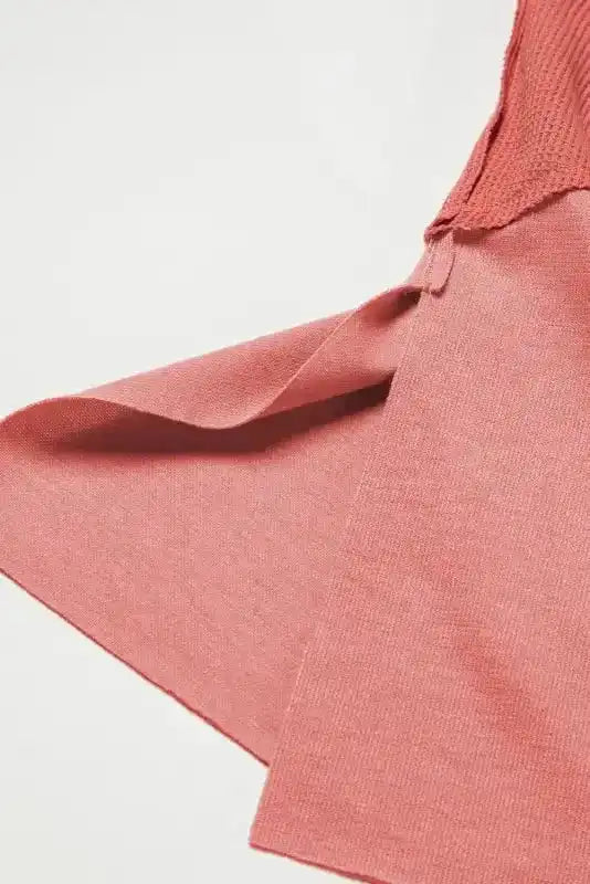Side slit detail of dusty rose Women's Exposed Seam Waffle Knit Tunic Top, enhancing movement and casual style.