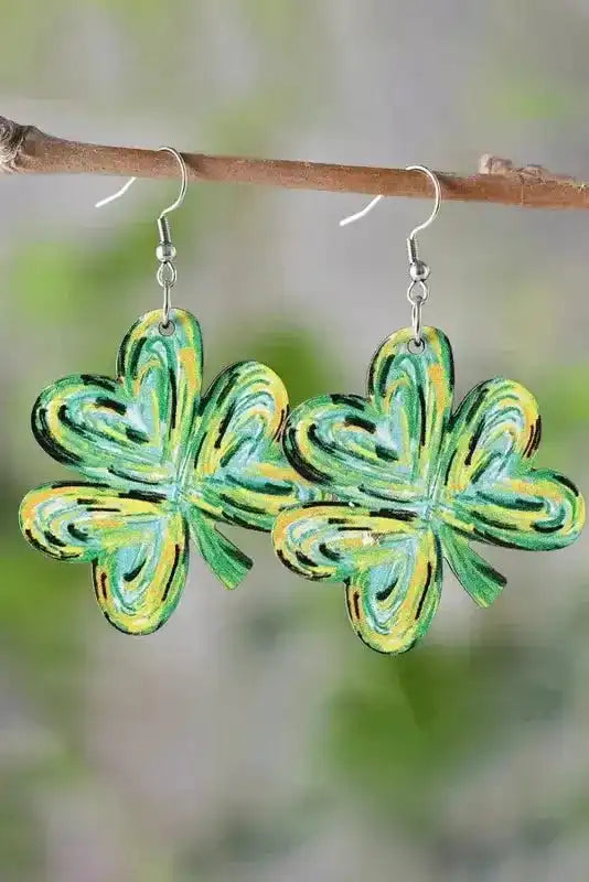 Light Green St. Patrick Painted Shamrock Shape Drop Earrings hanging from a branch, featuring festive swirled green and yellow design.