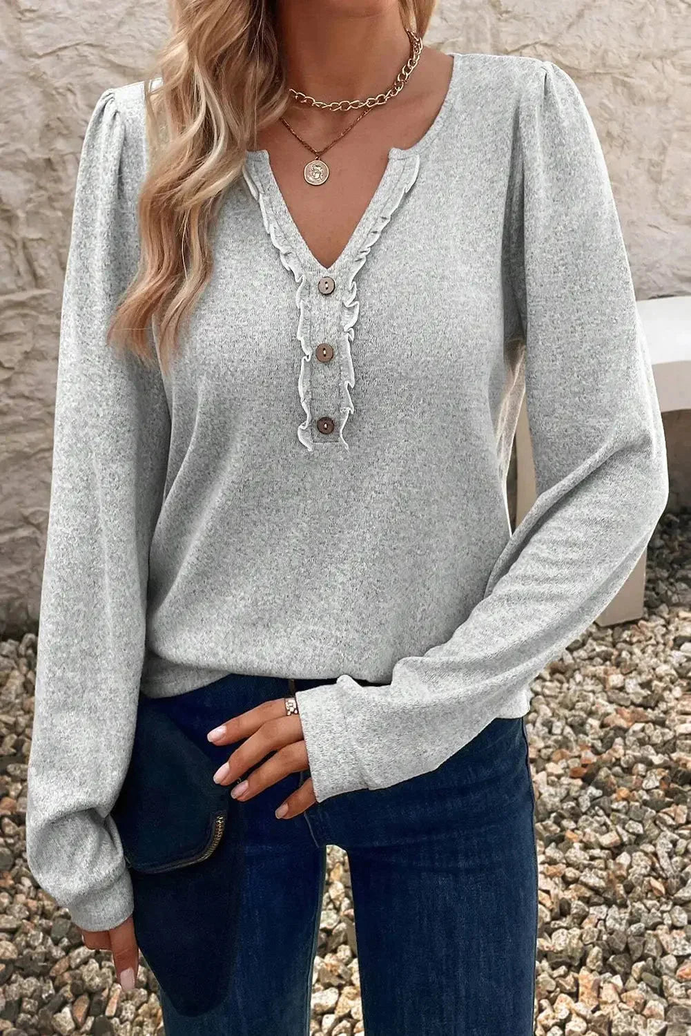 Light grey frilly notched neck button detail long sleeve top