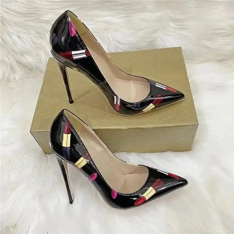 Lipstick-themed stiletto high heels with pointed toe and PU leather finish, designed for bold fashion statements and night-out glam.