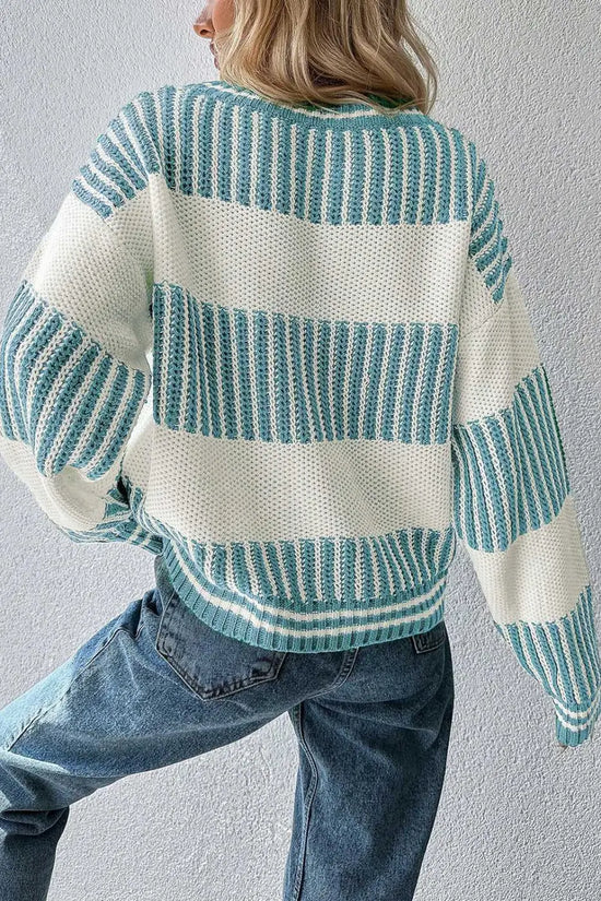 Soft cotton-acrylic jumper in pale blue tones, styled with trousers