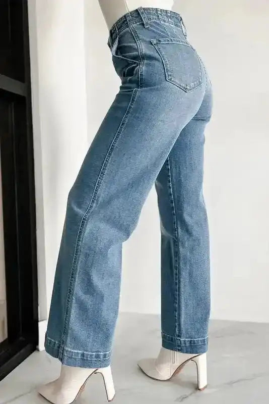 Close-up of multi-button front and dusk blue wash denim on loose leg straight jeans, Fashionfitz UK
