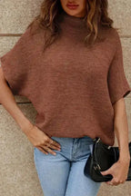 Brown version of high neck short bat sleeve sweater styled with jeans. Cozy knit top for autumn fashion from FashionFitz.