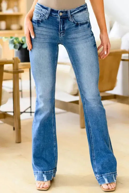 Woman wearing medium wash high waist flare jeans front view — Fashionfitz UK