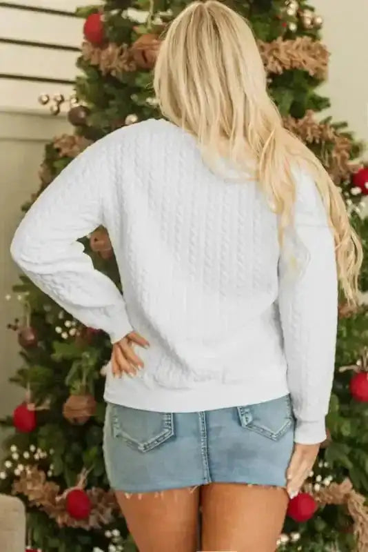 Back view of white Merry And Bright Cable Knit Sweatshirt showing cable knit texture and relaxed fit.