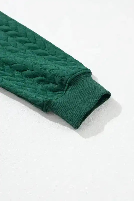 Sleeve detail of Merry And Bright Cable Knit Sweatshirt | FashionFitz featuring ribbed cuff and quilted knit texture.