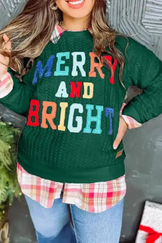 Merry And Bright Cable Knit Sweatshirt | FashionFitz styled with plaid shirt and jeans, perfect for Christmas-themed outfits.