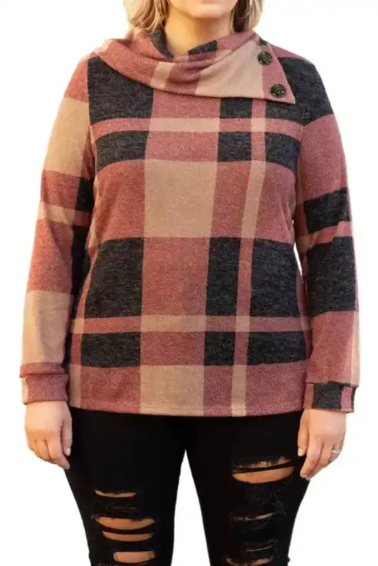 Studio shot of plus size mineral red plaid top with asymmetric neck and button accents, designed for comfortable and stylish daily wear.