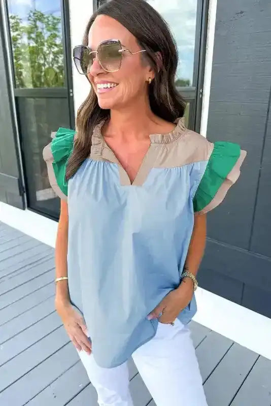 Side view of Mist Blue Ruffled Sleeve Frill V-Neck Blouse showing ruffle sleeve movement and colour block detail — Fashionfitz