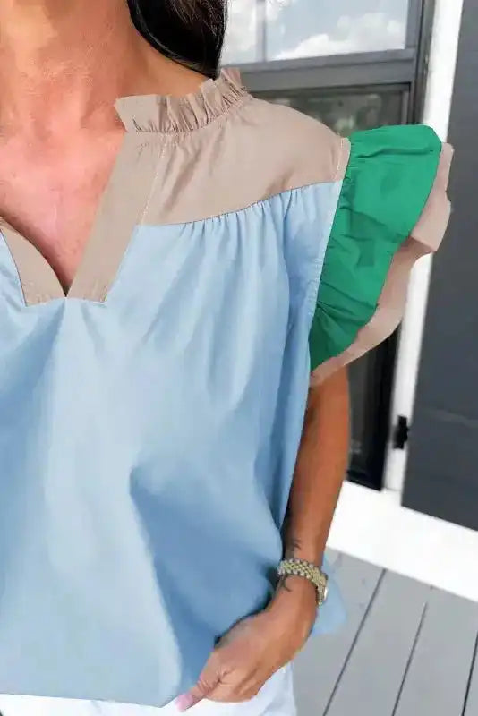 Close-up of Mist Blue Colour Block Blouse showing frill V-neckline and ruffled sleeve detail — Fashionfitz