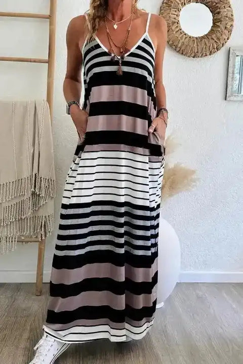 Woman wearing mixed stripe spaghetti strap maxi dress with V-neck, front view, Fashionfitz UK