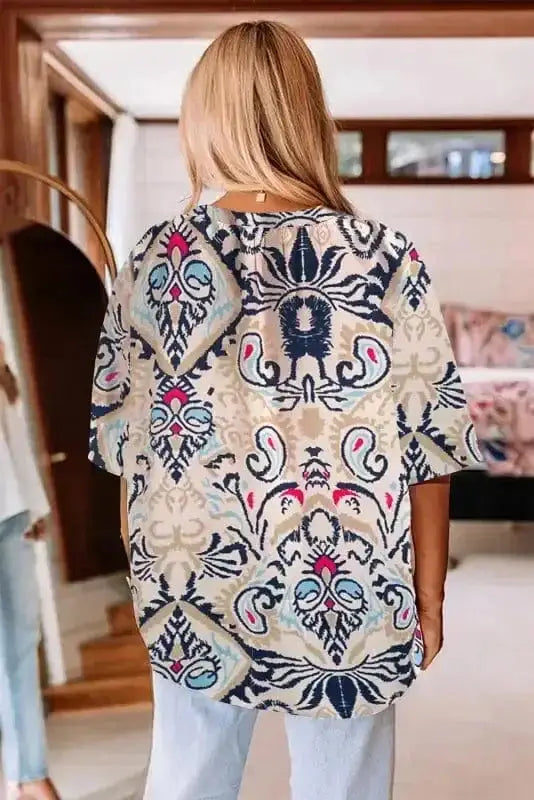 Back view of Loose Fit Notch Neck Boho Holiday Blouse showing comfortable loose silhouette and shirred detail — Fashionfitz