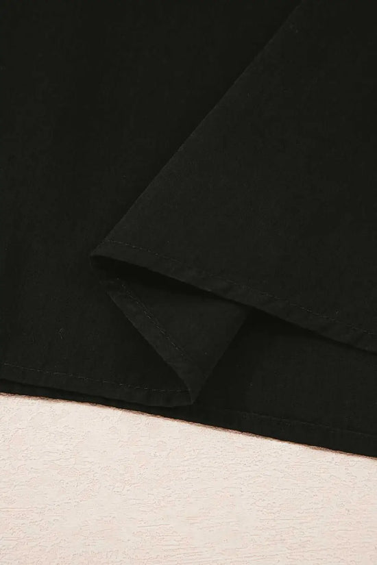 Hem detail of Monochrome Knit Dress - Cozy & Stylish | FashionFitz showing clean stitching and lightweight black skirt fabric.