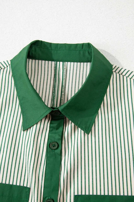 Close-up of green striped mini dress collar and button placket, showcasing modern contrast design and lightweight fabric.