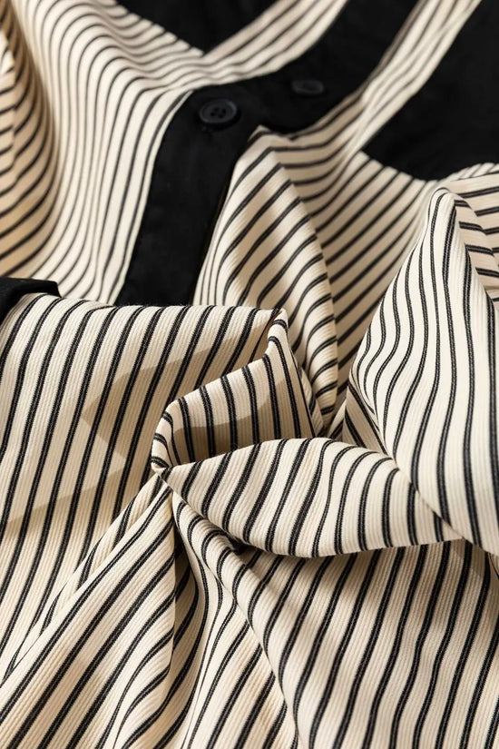 Textured view of Monochrome Striped Puff Sleeve Mini Dress fabric showing soft, lightweight material with black and white stripes.