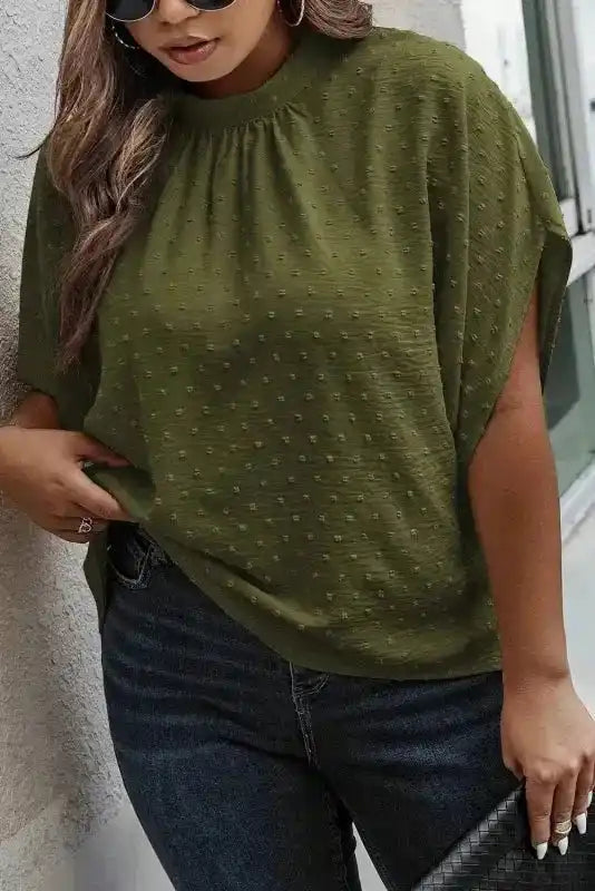 Elegant plus size moss green Swiss dot blouse with mock neck and flowy silhouette, styled for a versatile summer fashion look.