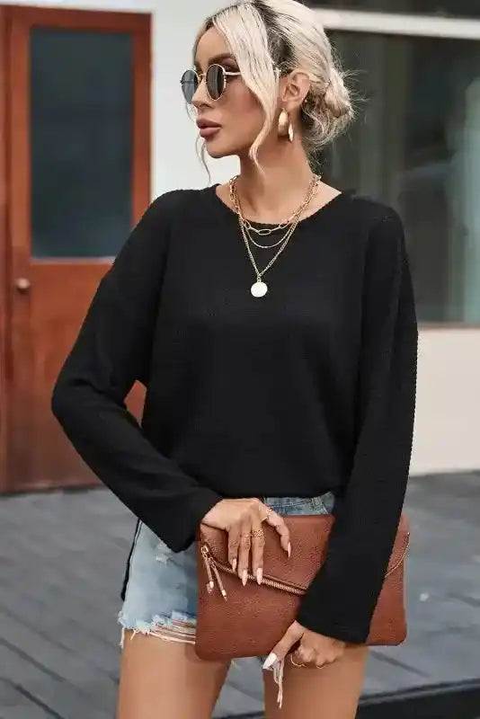 Chic Knit Top in moss green paired with a brown clutch and distressed shorts, highlighting its versatile plus size style.