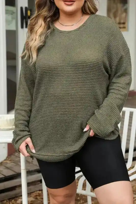 Close-up of Plus Size Moss Green Knit Top with long sleeves and solid color, ideal for layering in fall and autumn.
