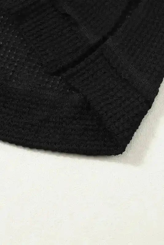 Hem detail of Plus Size Moss Green Knit Top with textured waffle knit and side slit, ideal for casual fall outfits.