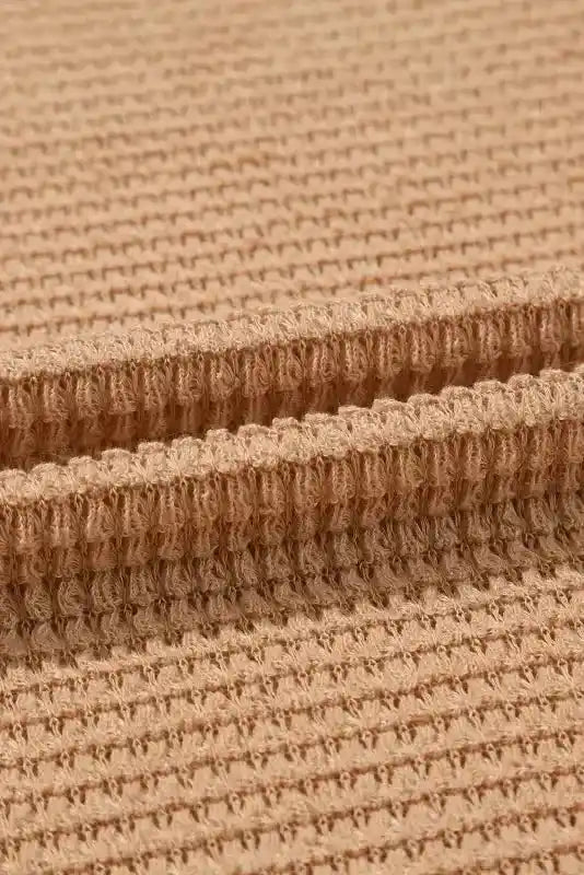 Detailed close-up of tan waffle knit fabric from Chic Knit Top - Plus Size Moss Green | Long Sleeve Style, emphasizing soft and breathable texture.