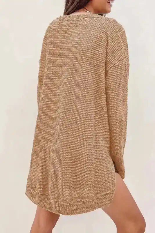 Back view of model in tan Chic Knit Top - Plus Size Moss Green | Long Sleeve Style, highlighting loose silhouette and waffle knit texture.
