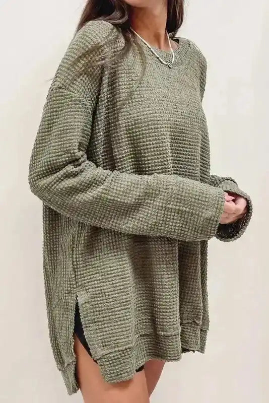 Side view of Chic Plus Size Moss Green Knit Top with long sleeves and split hem, perfect for casual daily wear in fall.