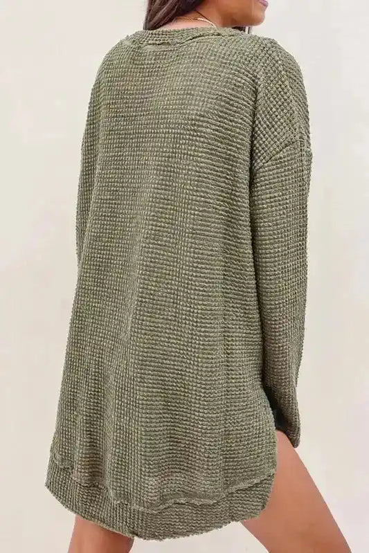 Back view of Plus Size Moss Green Knit Top showing relaxed fit and textured waffle knit fabric, ideal for autumn layering.