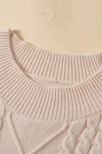 Close-up of ribbed mock neck on oatmeal plus cable knit short ruffled sleeve sweater, emphasizing comfort and structure.