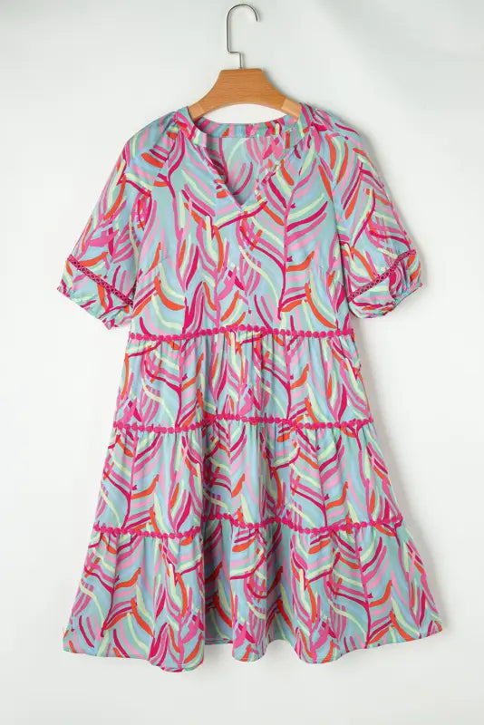 Ocean whispers puff sleeve dress: relax in a colorful leaf-patterned tiered dress on hanger