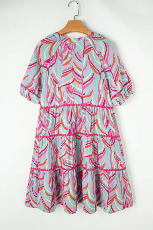 Ocean whispers puff sleeve dress: colorful tiered short-sleeve dress on wooden hanger