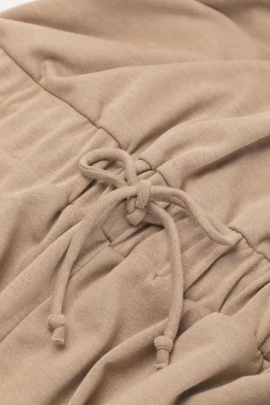 Beige drawstring detail on soft fabric of open back drawstring jogger jumpsuit - relax relax