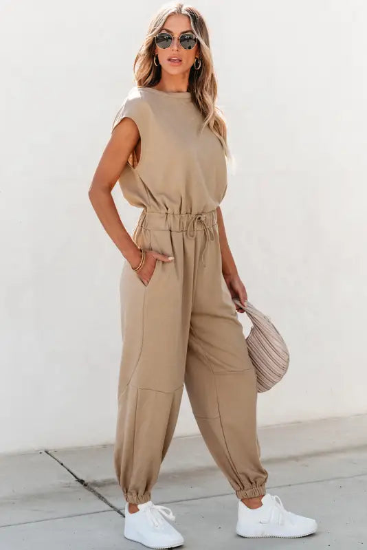 Open back drawstring jogger jumpsuit - beige, sleeveless, relaxed fit, tapered legs