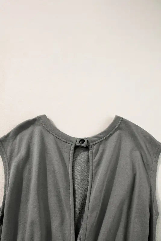 Gray sleeveless top with button closure at neckline; perfect for relax in a jogger jumpsuit