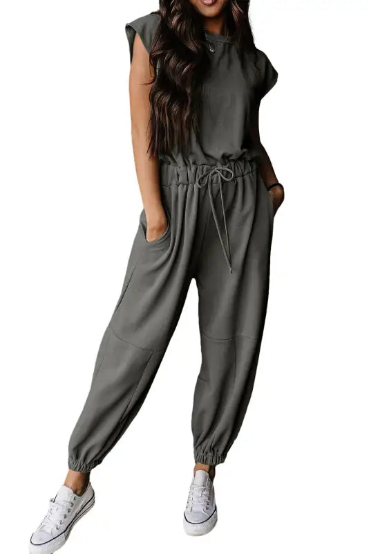 Gray short-sleeve jogger jumpsuit with drawstring, tapered legs, perfect for relax relax days