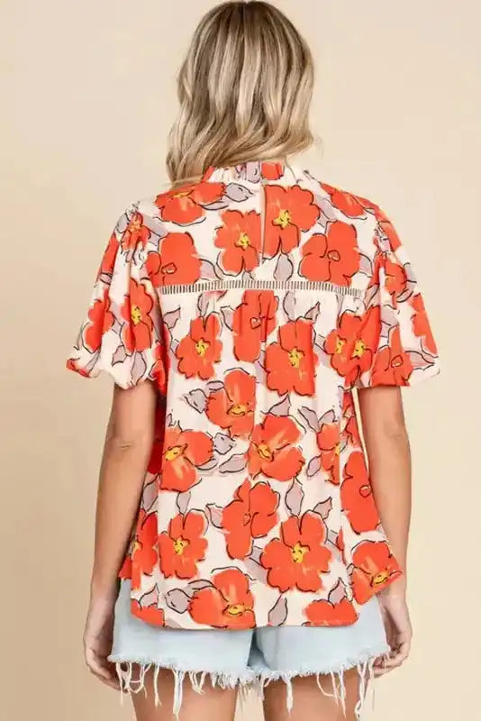 Back view of Orange Floral Loose Fit Blouse showing generous loose silhouette and short sleeves — Fashionfitz