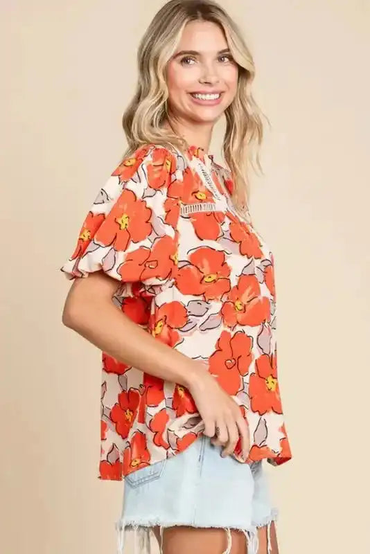 Side view of Orange Floral Loose Blouse showing flowing loose fit and hollow-out cutout trim at neckline — Fashionfitz