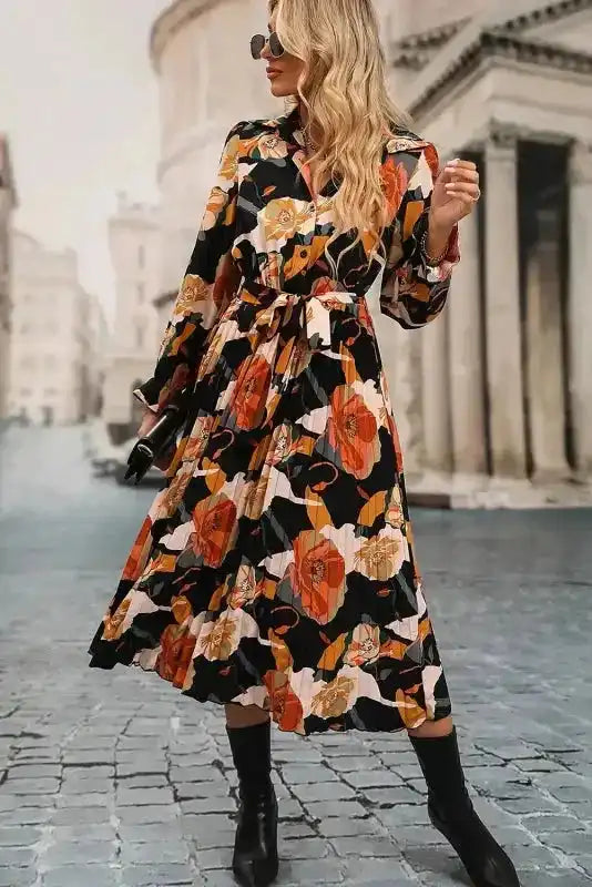 Front pose of model in Orange Floral Long Sleeve Dress with tie waist and floral print, ideal for Southern Belle-inspired fashion.